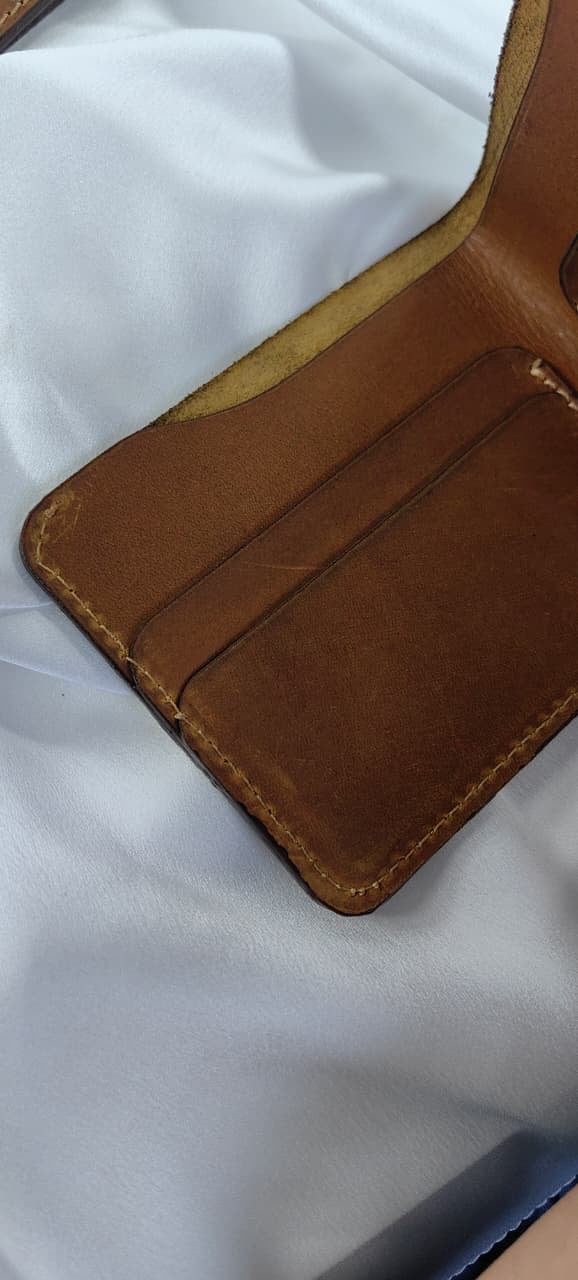 MNSA full-grain leather bifold wallet, real product photography, angle 4