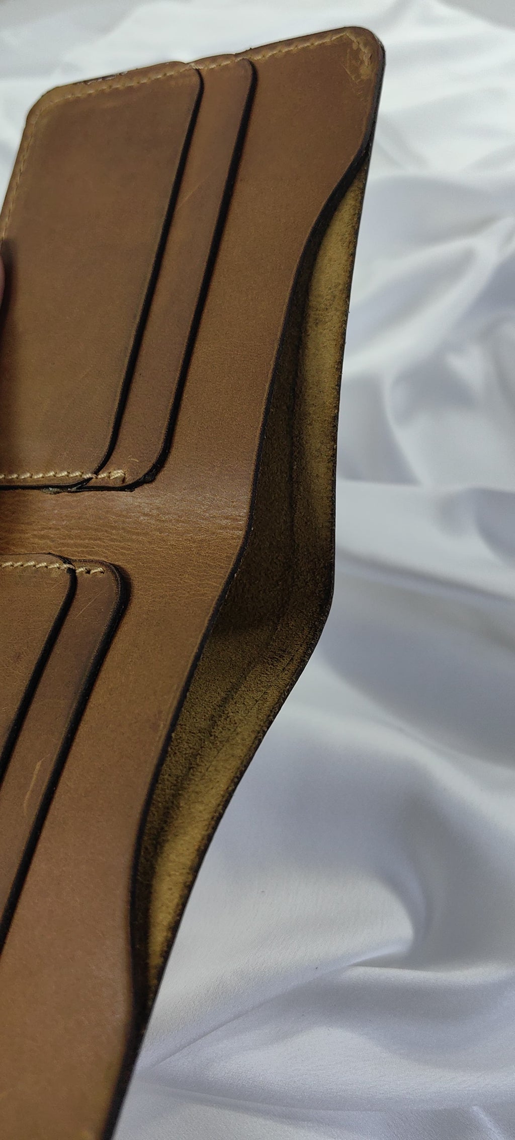 MNSA full-grain leather bifold wallet, real product photography, angle 5