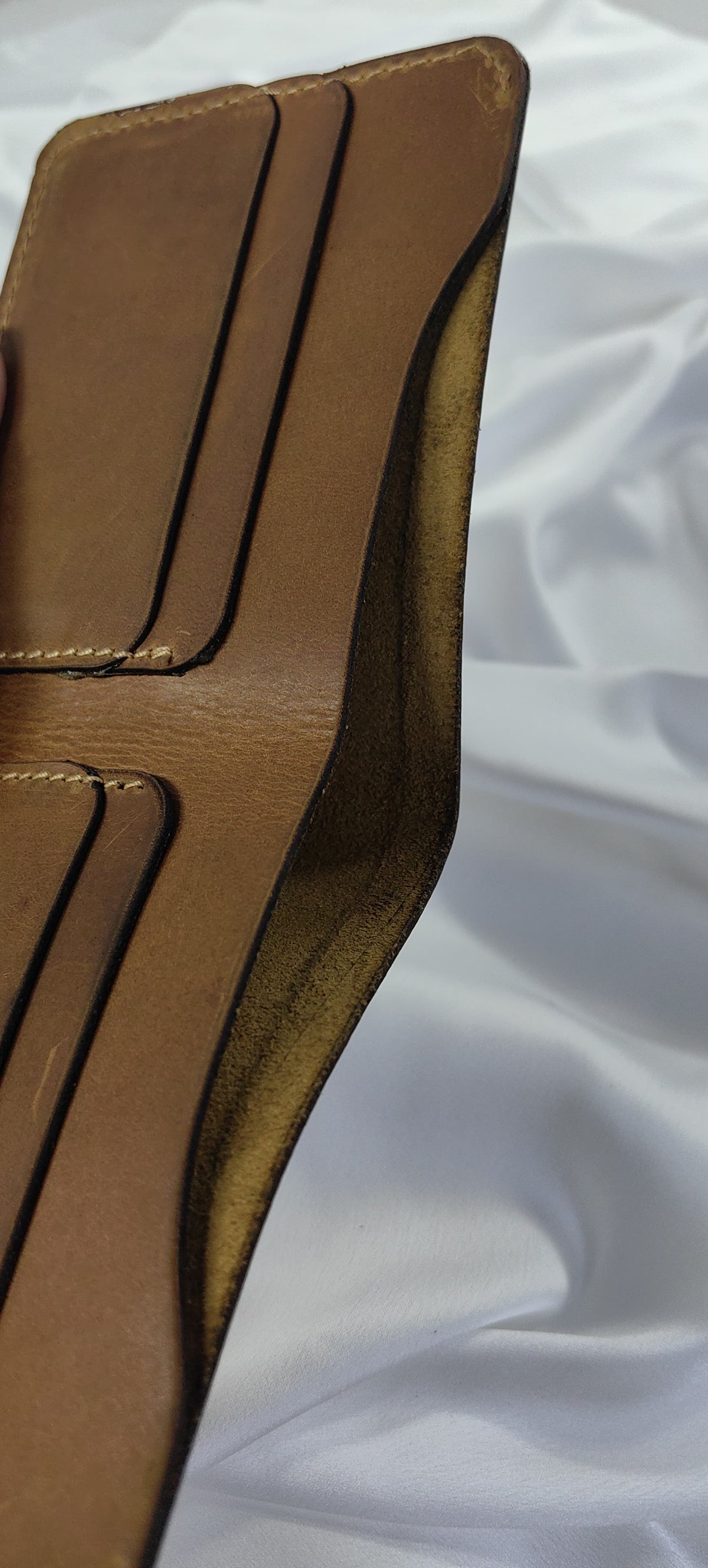 MNSA full-grain leather bifold wallet, real product photography, angle 5