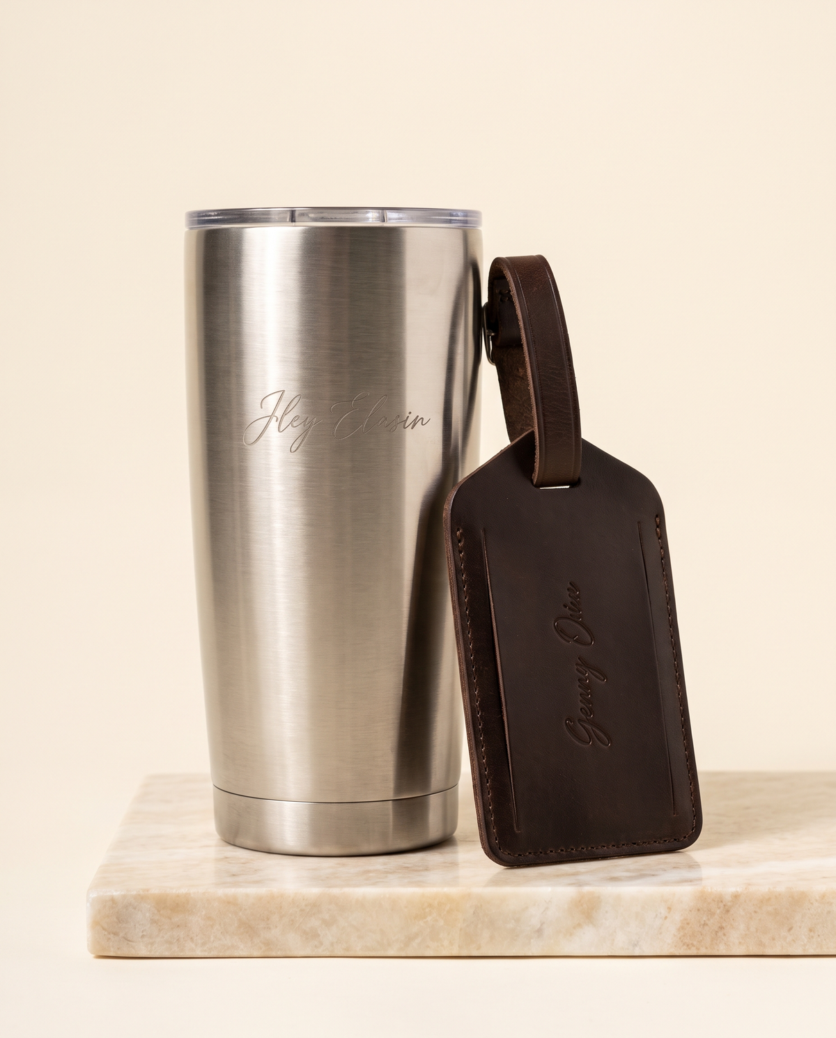 MNSA Welcome Set, tumbler and leather tag, AI-generated product visualization