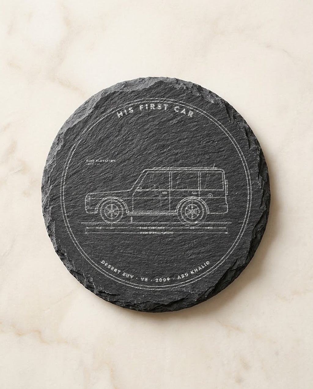 Car blueprint engraved on a round slate coaster