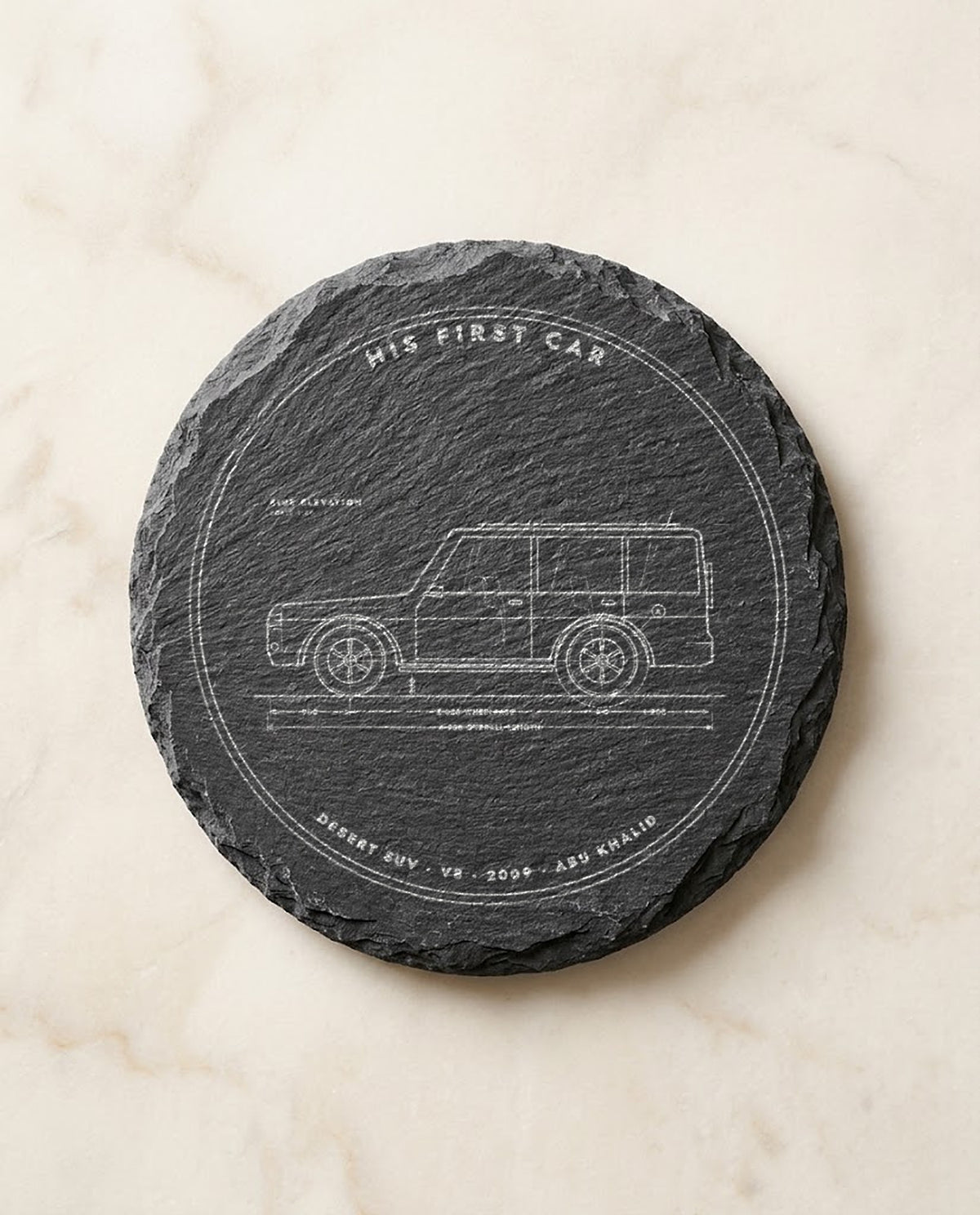 Car blueprint engraved on a round slate coaster