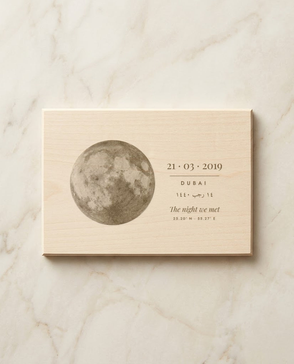 Moon and date engraved on a basswood plaque