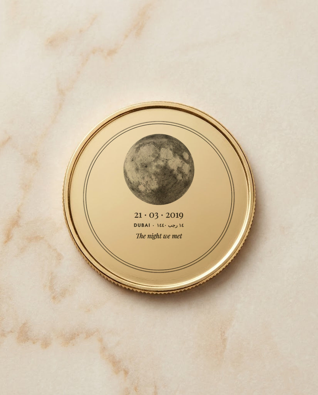 Moon and date engraved on a gold metal coin