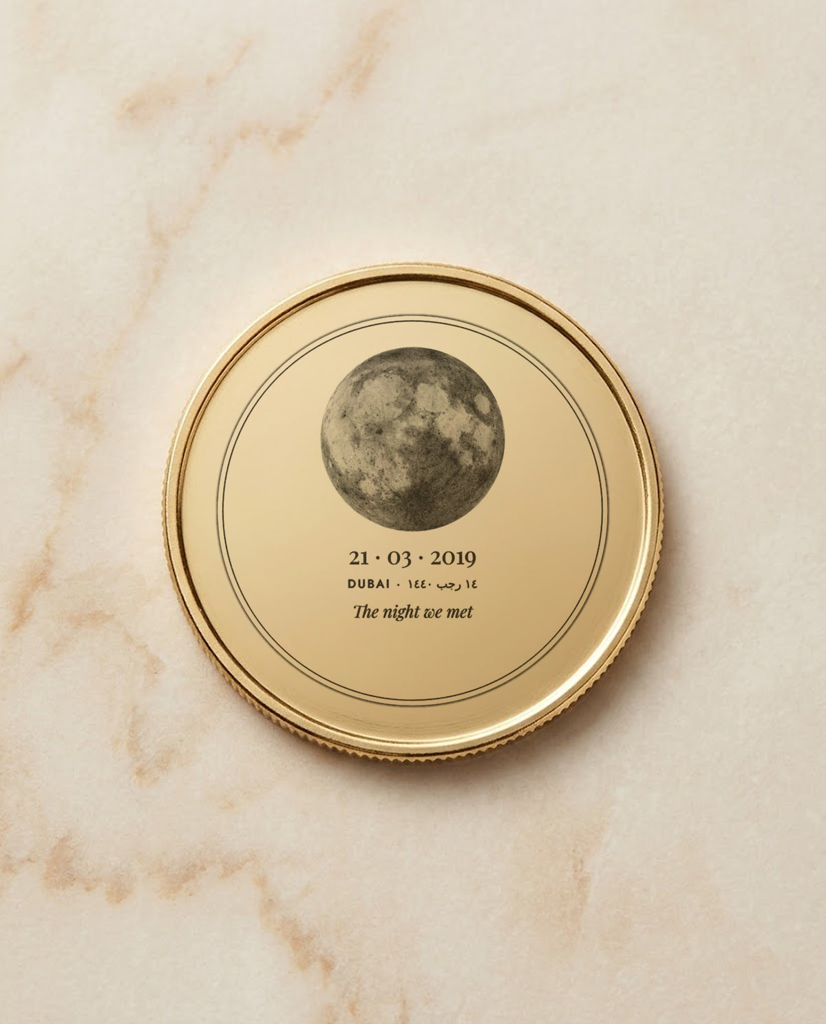 Moon and date engraved on a gold metal coin