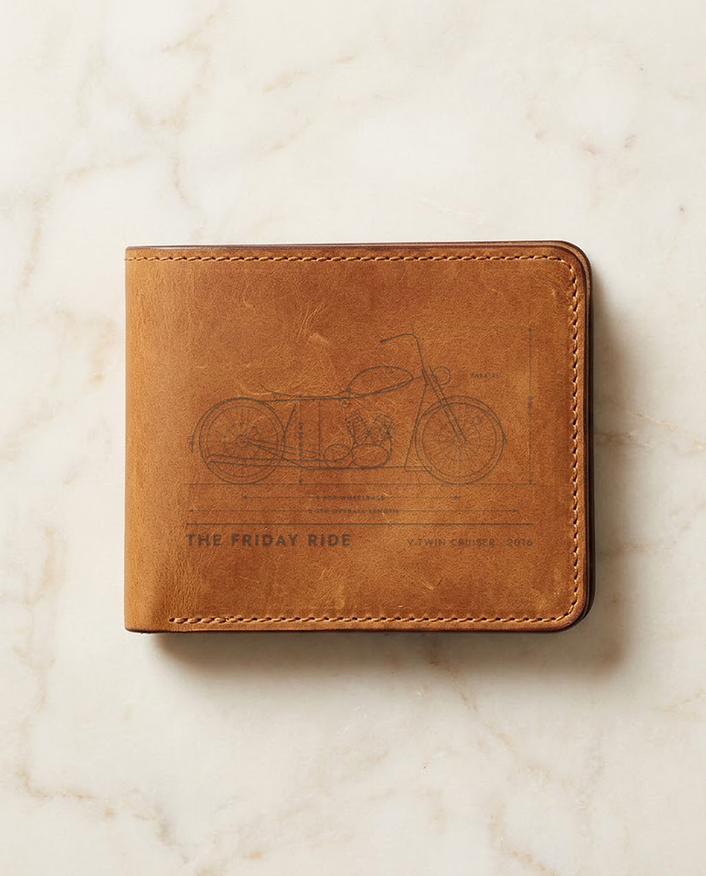 Motorbike blueprint laser engraved on a tan leather wallet