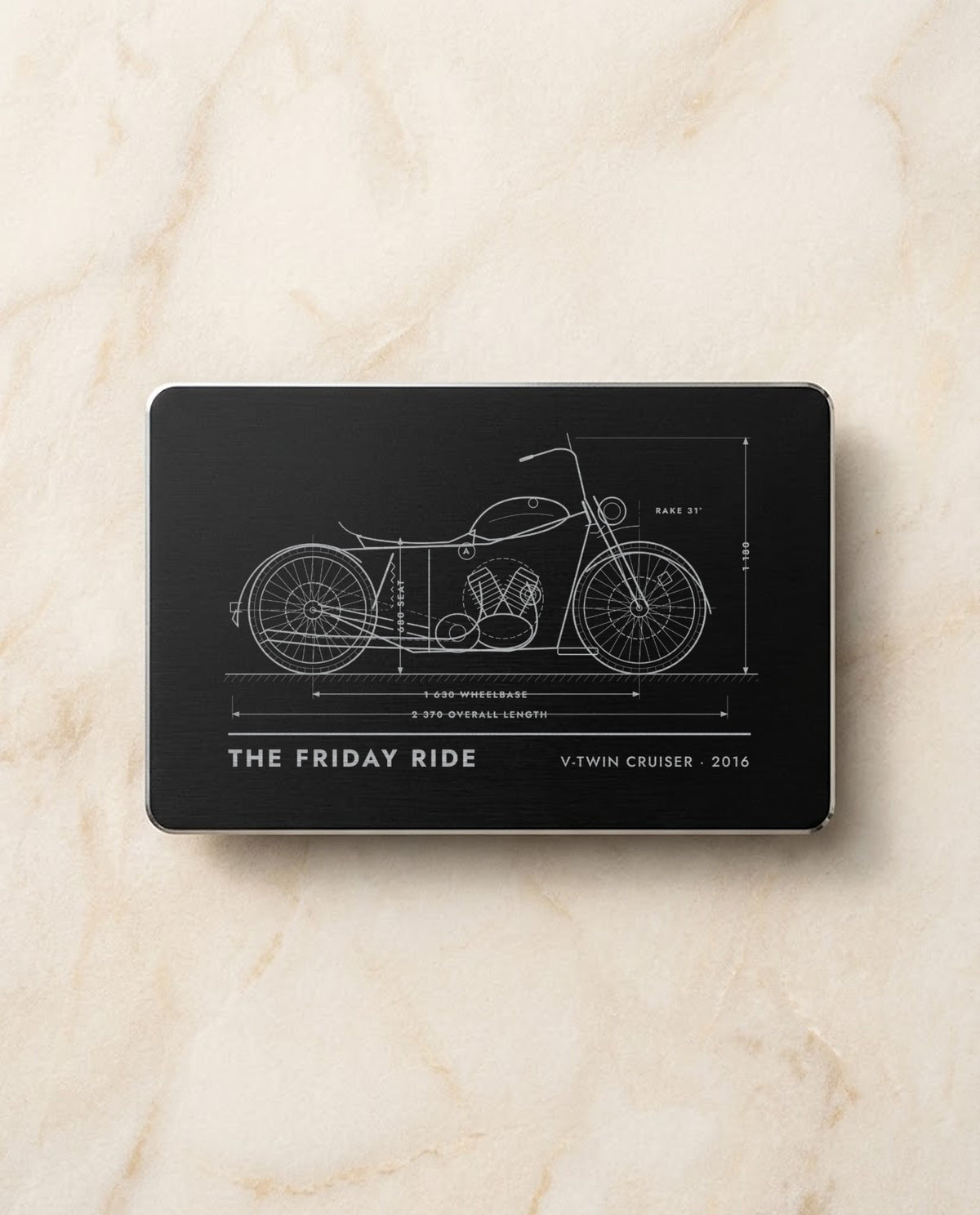 Motorbike blueprint engraved in bright steel on a black metal card