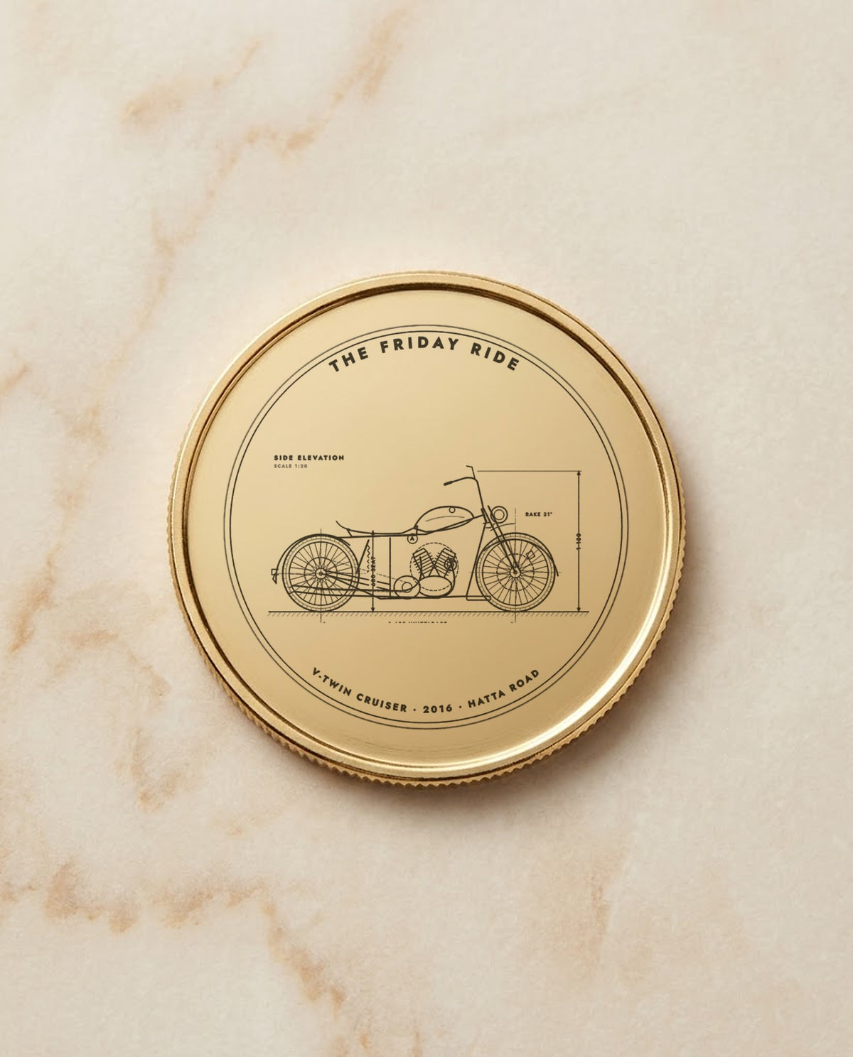 Motorbike blueprint engraved on a gold metal coin
