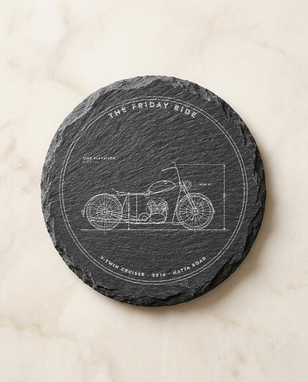 Motorbike blueprint engraved on a round slate coaster