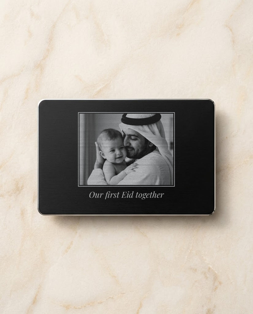 Family photo engraved in bright steel on a black metal card