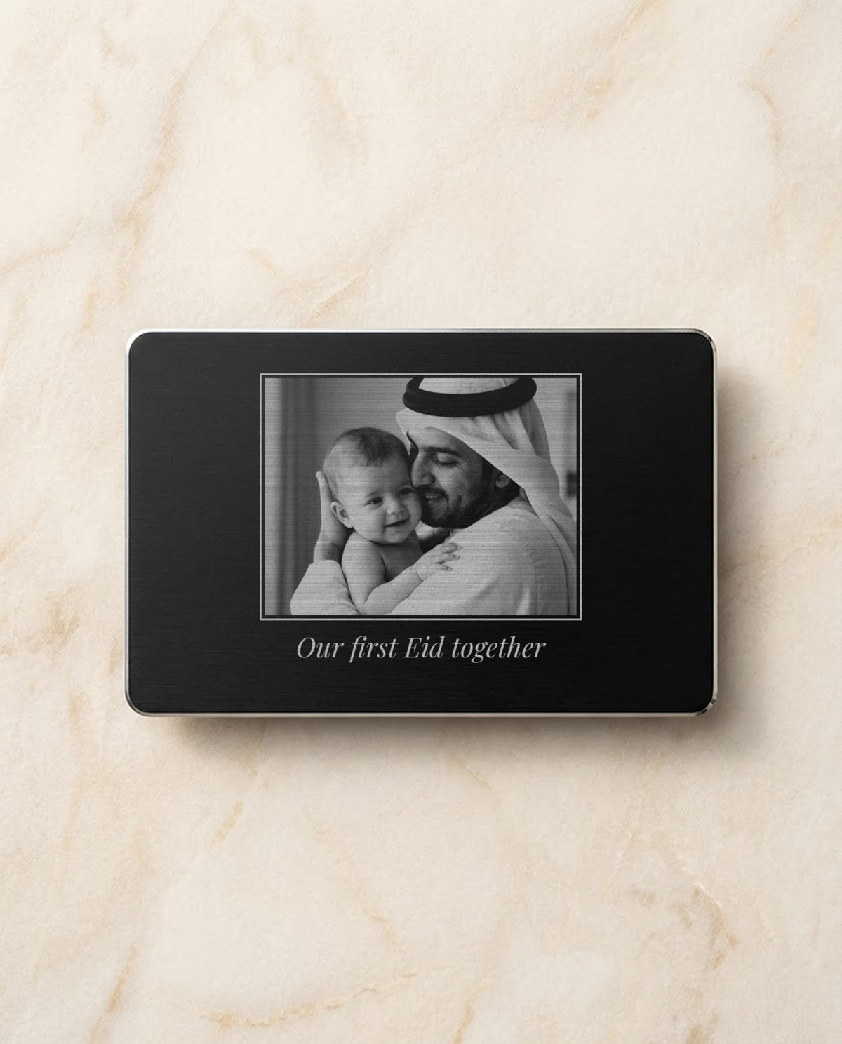 Family photo engraved in bright steel on a black metal card