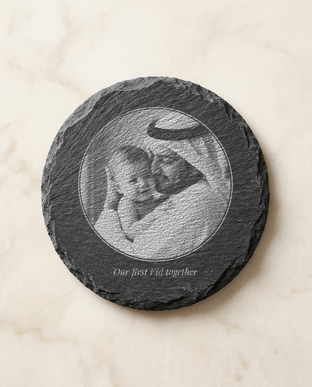 Family photo laser engraved on a round slate coaster
