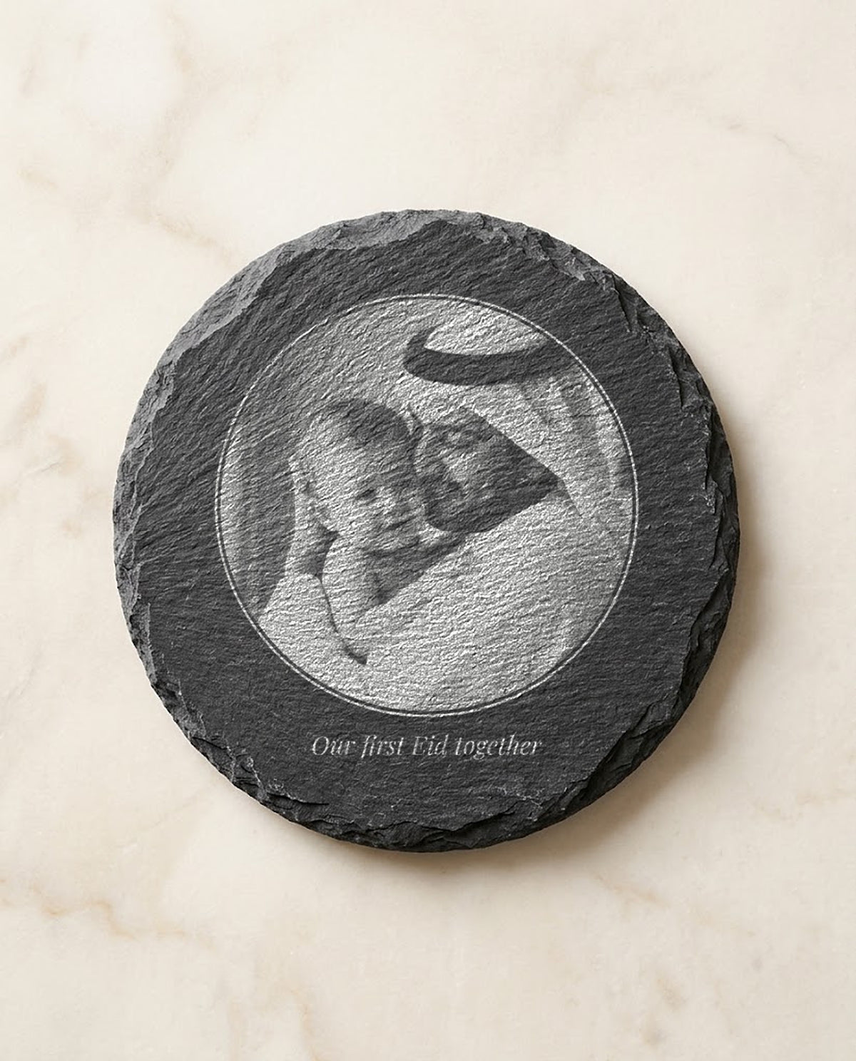 Family photo laser engraved on a round slate coaster